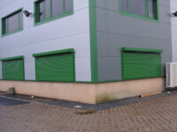 Green commercial shutters made bespoke to suit your business aesthetic and brand